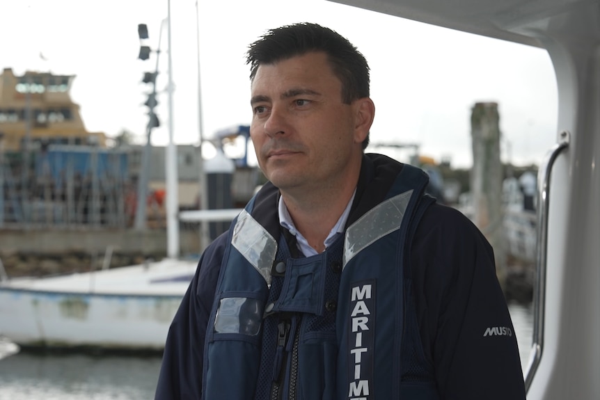 A man standing on a boat.