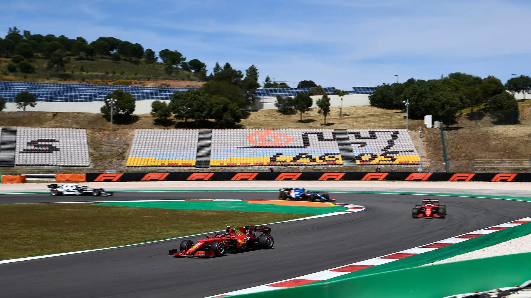 Carlos Sainz Jr in front of Ferrari teammate Charles Leclerc and others during the 2021 Portuguese Grand Prix in Portimao