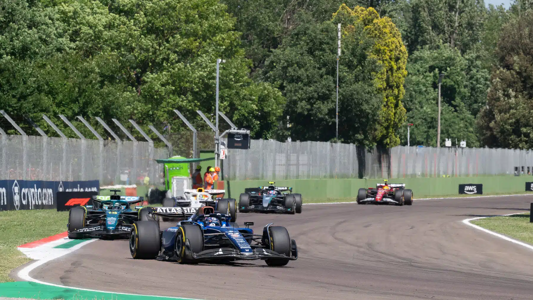 Alexander Albon (Williams-Mercedes) leads Fernando Alonso (Aston Martin-Mercedes) and others during the 2025 Emilia Romagna Grand Prix