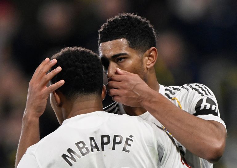 Real Madrid's Kylian Mbappe talks with Jude Bellingham before taking a penalty