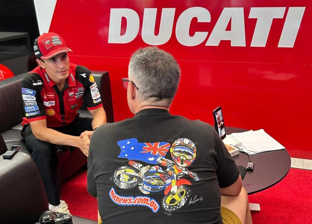 Marc Márquez in Ducati colours speaking during an interview about MotoGP aerodynamics and overtaking.
