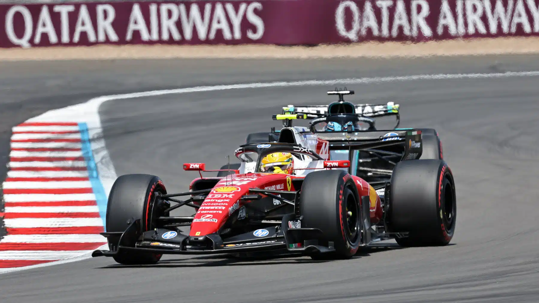 Lewis Hamilton (Ferrari) in front of George Russell (Mercedes) during practice for the 2026 British Grand Prix