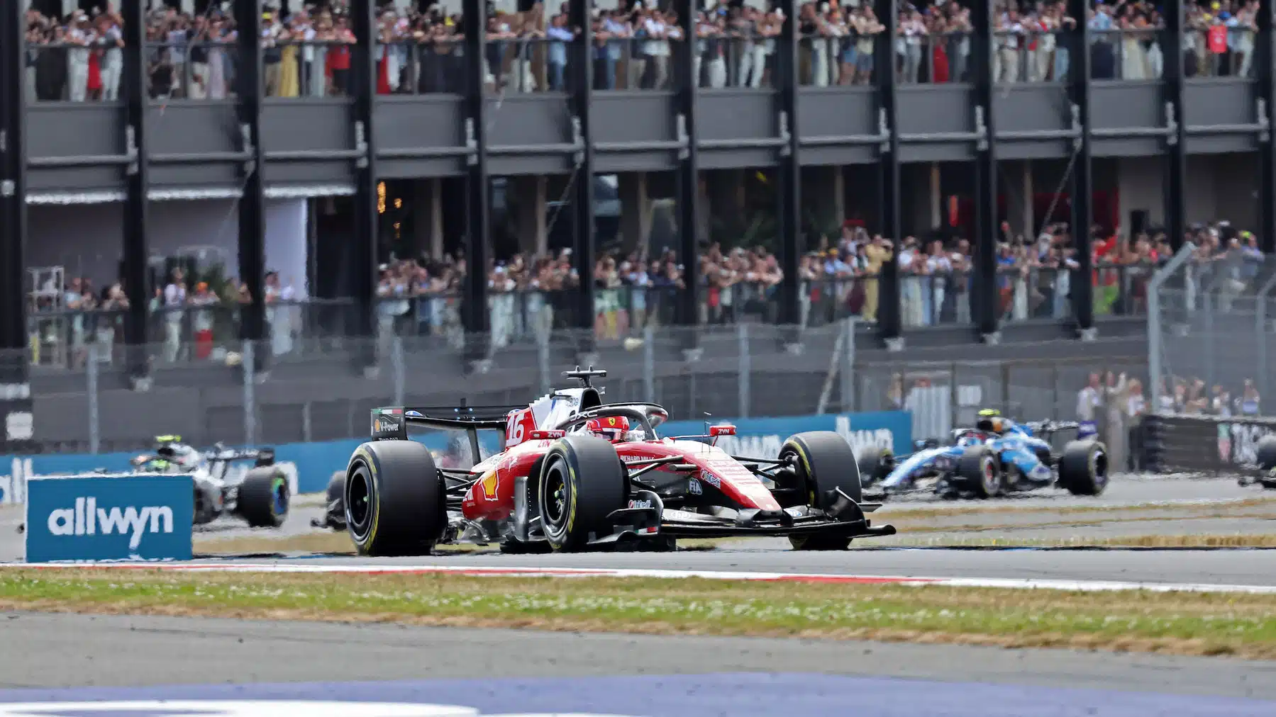 Charles Leclerc (Ferrari) leads the field into the second corner after the start of the 2026 British Grand Prix