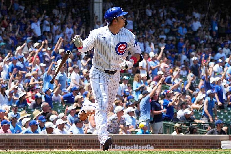 Chicago Cubs' Seiya Suzuki of Japan, watches his three-run home run during the first inning of a baseball game against the San Diego Padres in Chicago, Wednesday, July 1, 2026. (AP Photo/Nam Y. Huh)