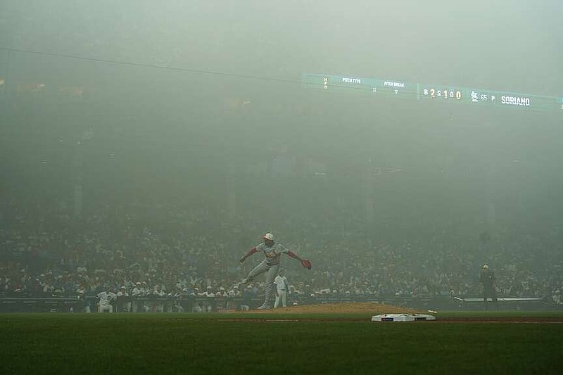 St. Louis Cardinals pitcher Kyle Leahy throws the ball in the fog against the Chicago Cubs during the sixth inning of a baseball game Saturday, July 4, 2026, in Chicago. (AP Photo/David Banks)