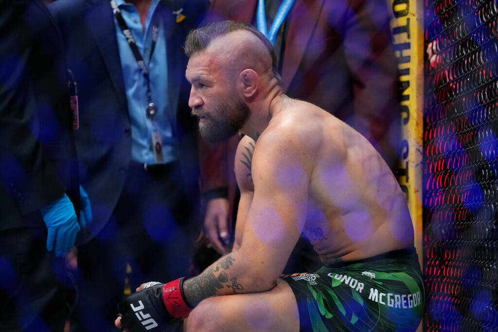 Conor McGregor reacts after losing to Max Holloway in a welterweight fight at the UFC 329 mixed ...