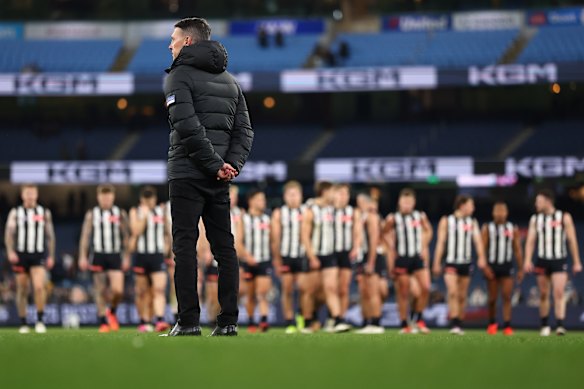 Craig McRae looks on as the Magpies leave the ground.