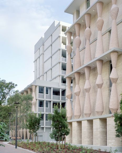 Artist Natalie O’Loughlin designed a series of playful public art columns for The Rothschild, evoking abstracted caryatids.