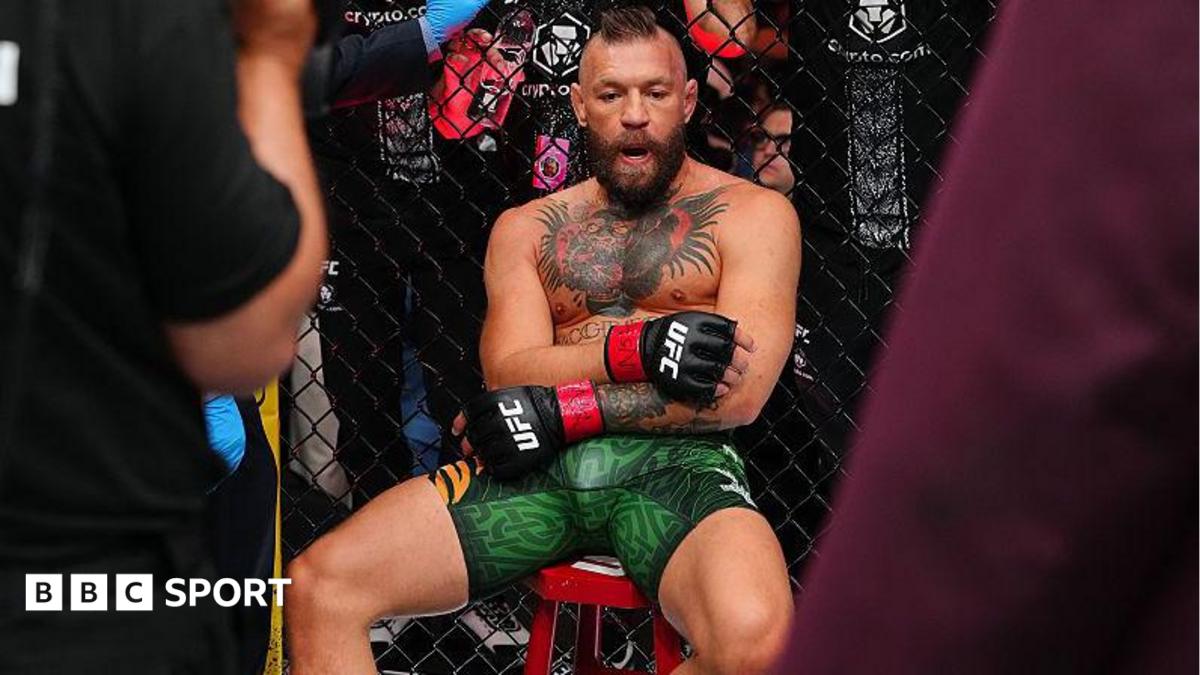 Conor McGregor sits on a stool