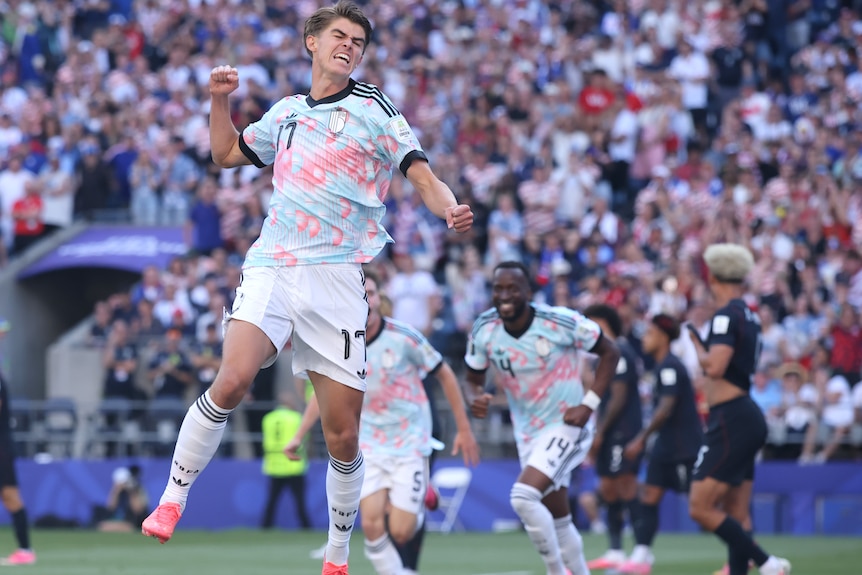 Charles De Ketelaere leaps in the air in celebration of a goal