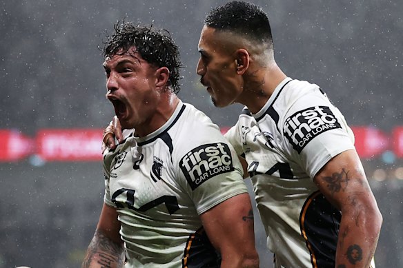 Brisbane centre Kotoni Staggs (left) celebrates his first-half try.