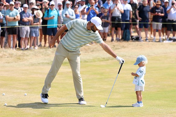 Scottie Scheffler with his son Bennett during a practice round ahead of the Open Championship. 