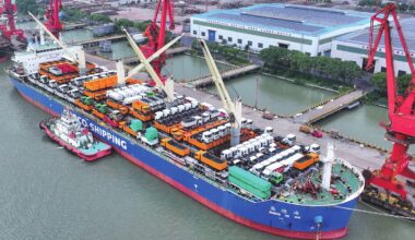A cargo vessel carrying engineering vehicles for export is seen at a port in Zhangjiagang, East China