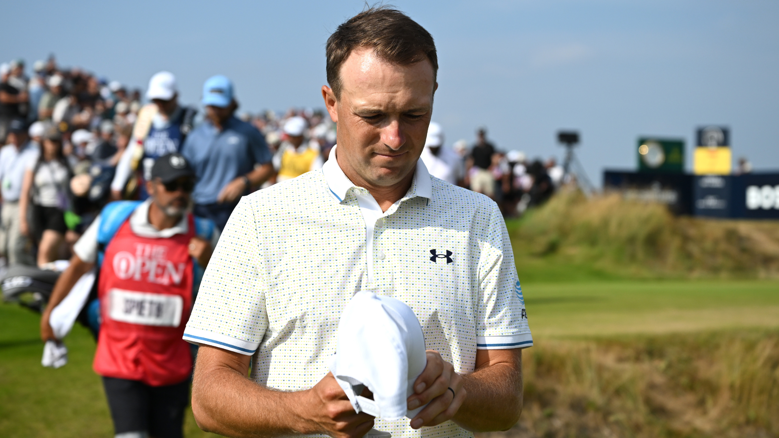 Jordan Spieth walks ahead of his caddie at The Open