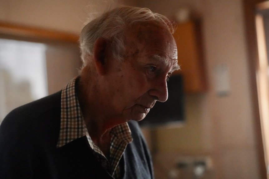 Dramatic close up portrait of Ray Gloster looking off to the side of the frame