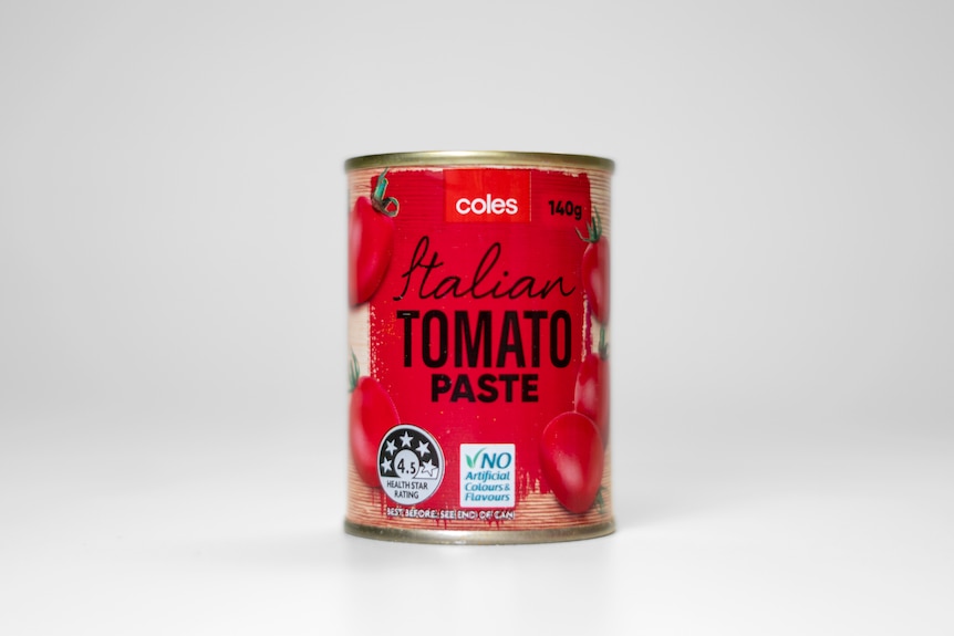 A tin sits in a white space. Its label says Coles Italian Tomato Paste.