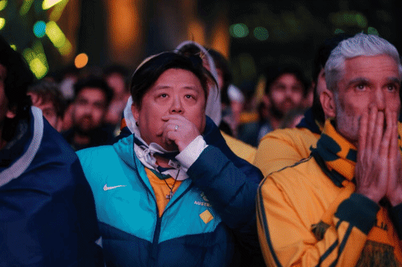 Fans watch the Socceroos at Fed Square.