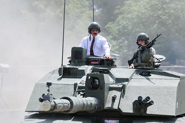 King Charles III rides in a Challenger 2 Main Battle Tank during The Royal Tank Regiment's Families' Day at the Tank Museum on July 06, 2026 in Bovington, Dorset.