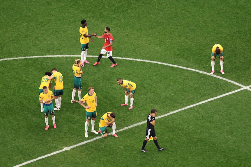 Mo Salah shakes the hands of the Aussie players