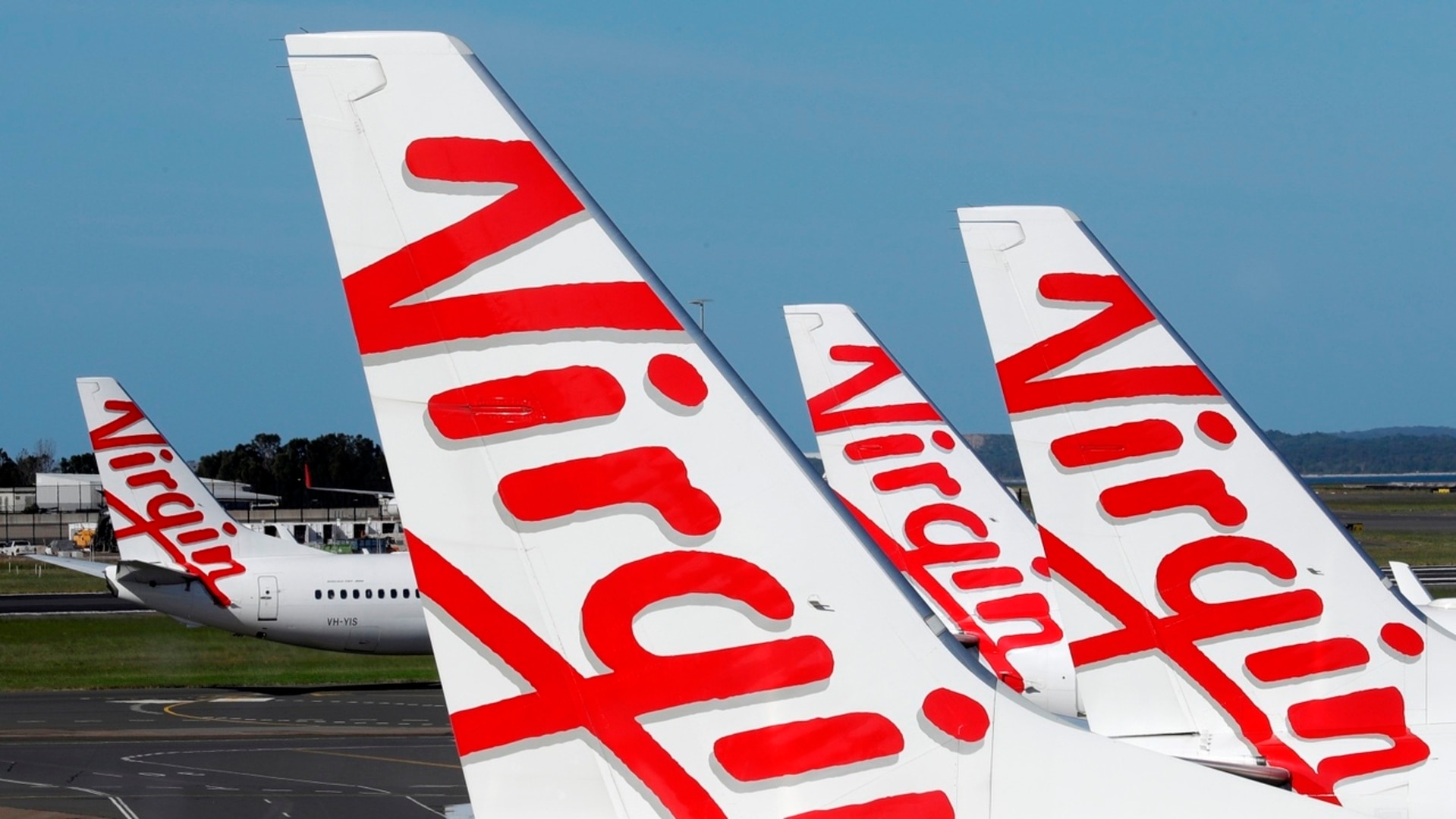 Virgin follows rival Qantas with higher fares and fewer flights