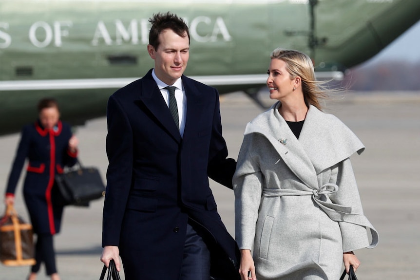 Jared Kushner and Ivanka Trump walk to Air Force One.