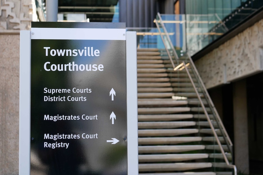 Sign in front of a building and stairs says Townsville Courthouse