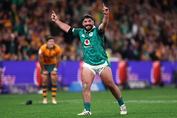 Tom O’Toole of Ireland celebrates victory, with a crestfallen Ben Donaldson in the background.