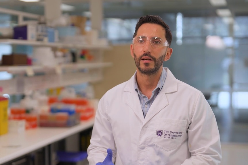 andres gambini from uq in a white lab coat