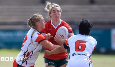 Bethan Dainton carries the ball into contact for Wales rugby league against Canada