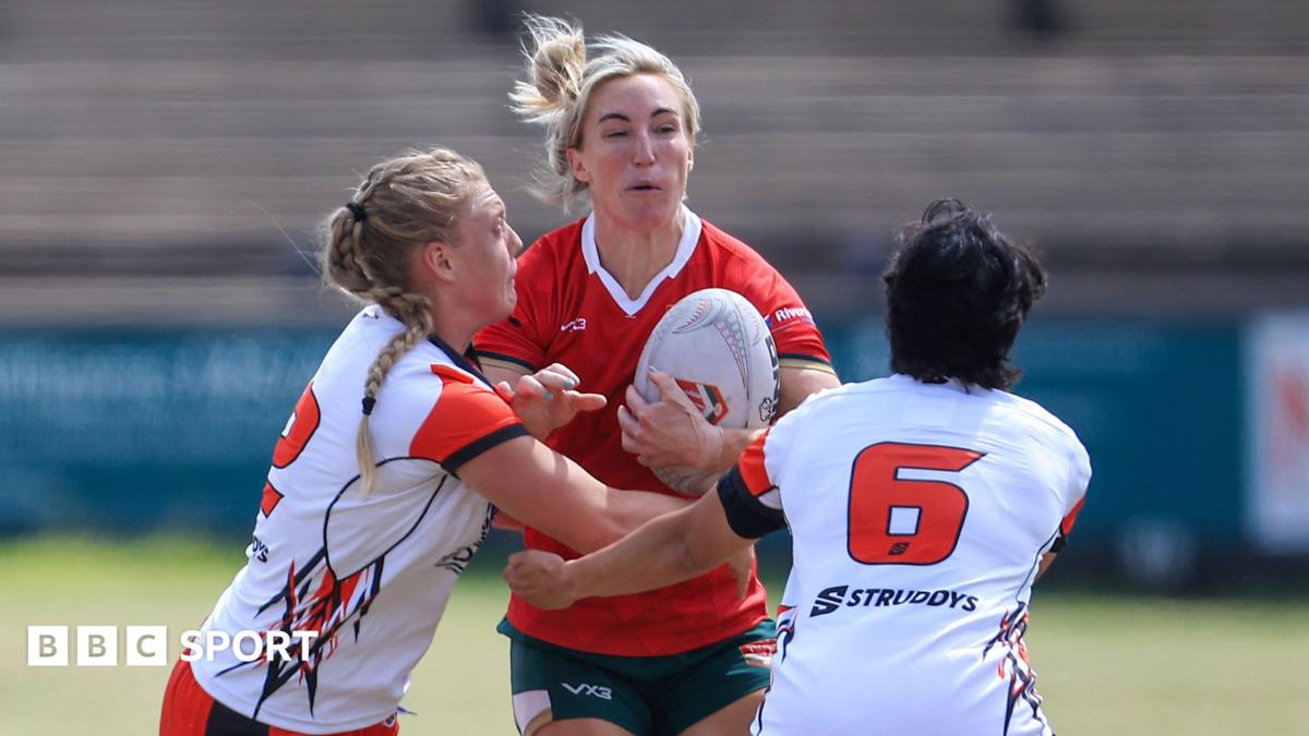 Bethan Dainton carries the ball into contact for Wales rugby league against Canada