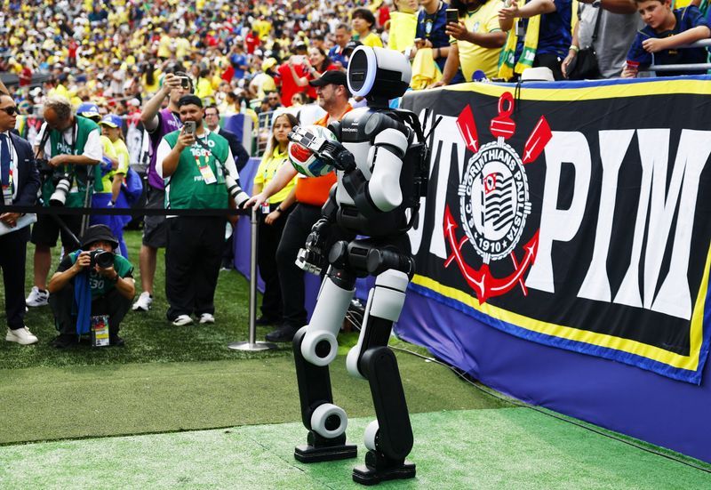 Football: Soccer-Atlas, the humanoid robot, delivers match ball at World Cup