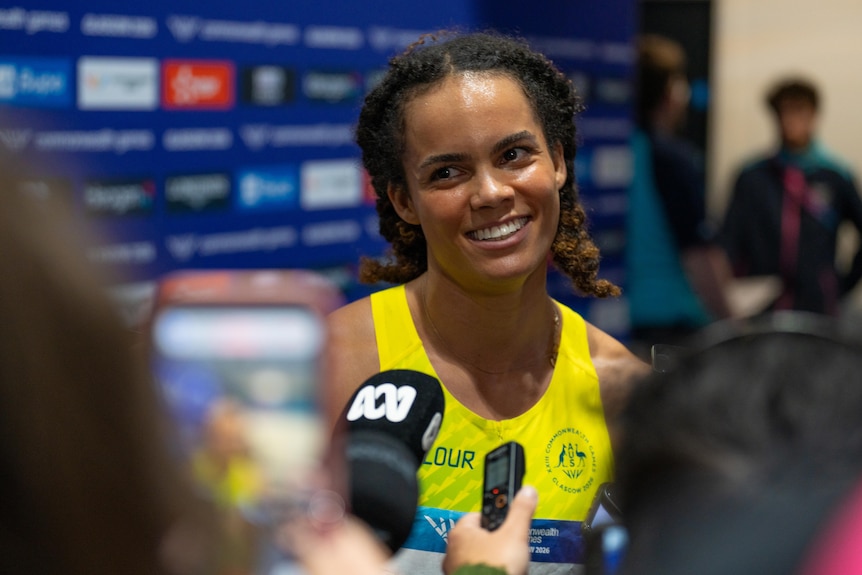 TOrrie Lewis speaks to the media after the Commonwealth Games 200m finals.