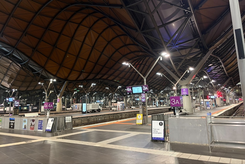 Empty platforms with no passengers or trains at Southern Cross Station.