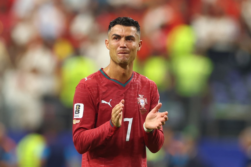 Cristiano Ronaldo crying on the field after a Portugal game