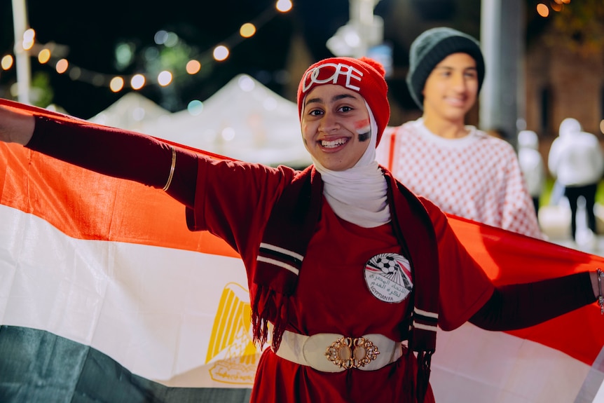 Happy female Egypt fan in Sydney at World Cup viewing party