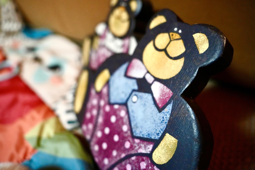 Close-up of a child's wooden bear toy.