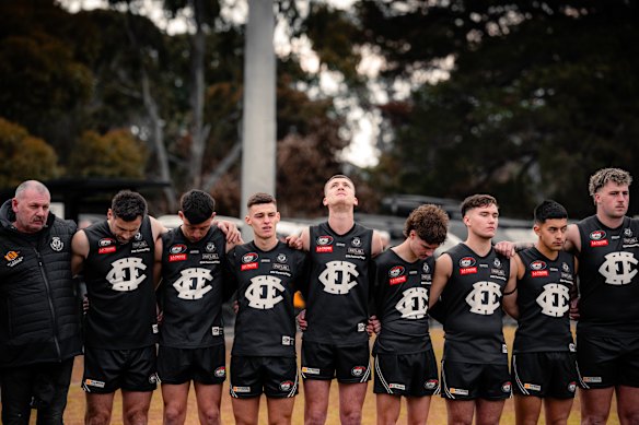 Epping footballers join in a moment of silence for Nathan Fitzgerald, who died after an on-field collision last weekend.