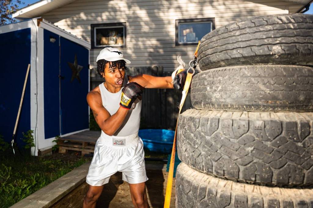 Mponda Kalunga throws punches at his backyard sparing target on Thursday, July 16, 2026. (Photo by Noah Korver/Yukon News)