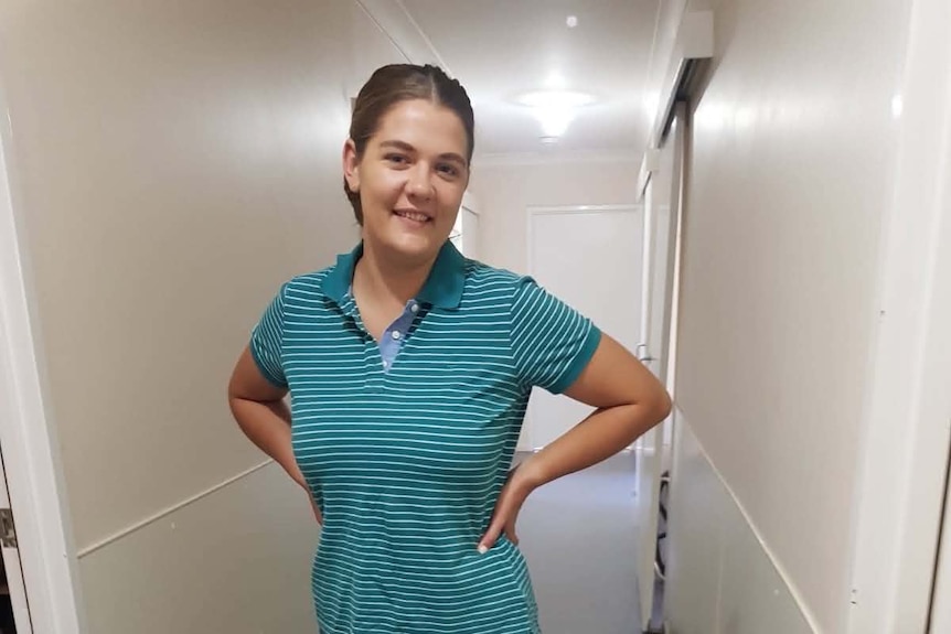 woman standing in hallway