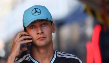 George Russell looks sad on the phone