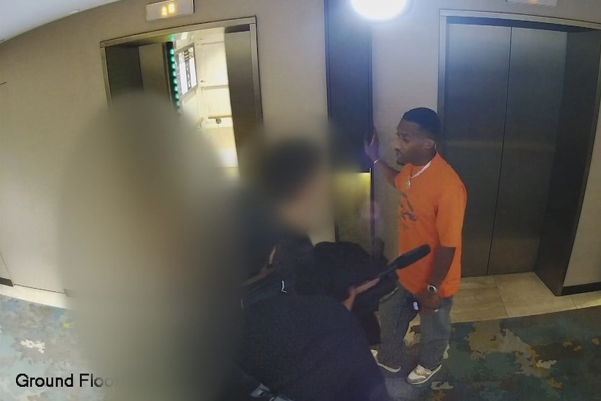 A CCTV image shows Yung Filly waiting to enter a lift standing with his entourage and the blurred-out figure of a young woman.
