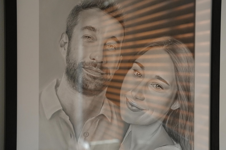 a framed drawing of a man and a woman