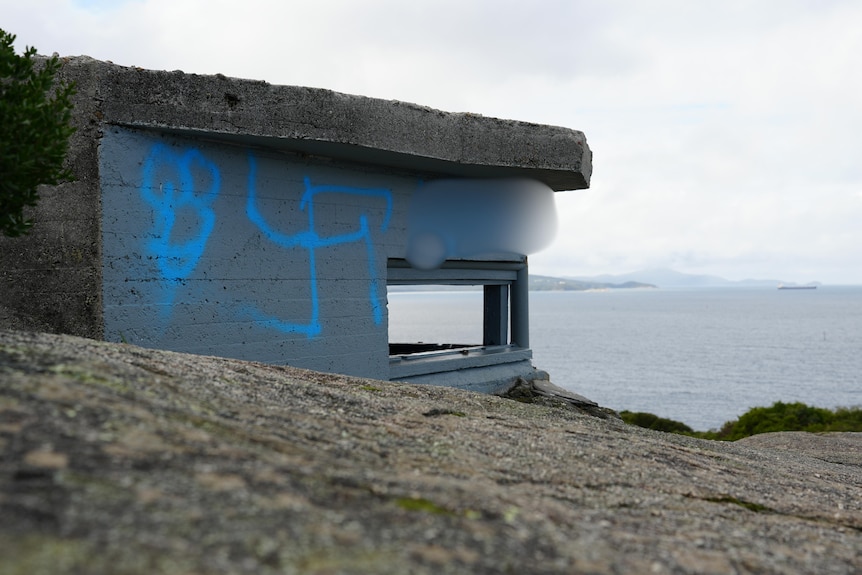 Graffiti sprayed onto a historic bunker.
