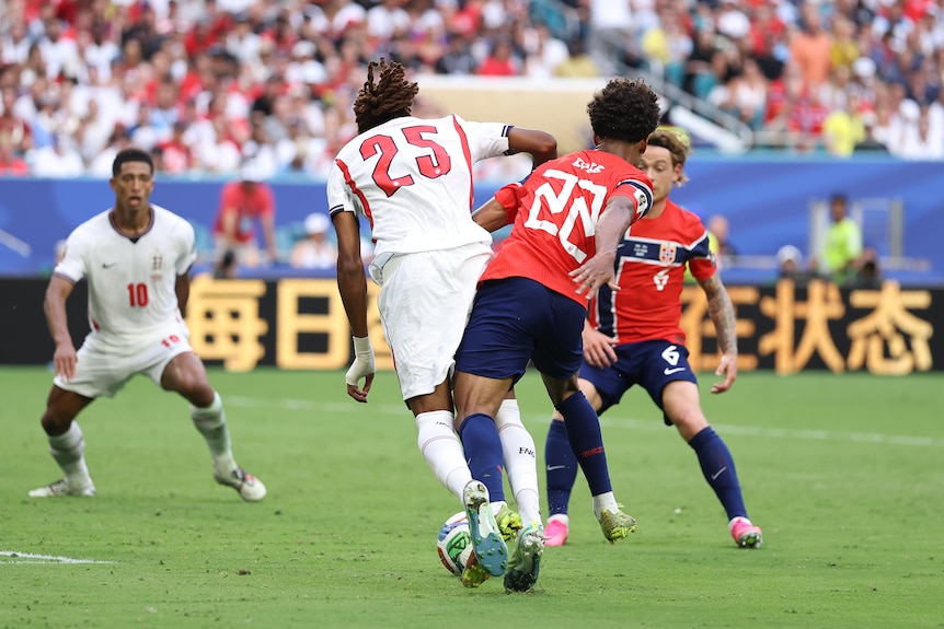 Djed Spence is fouled by Oscar Bobb