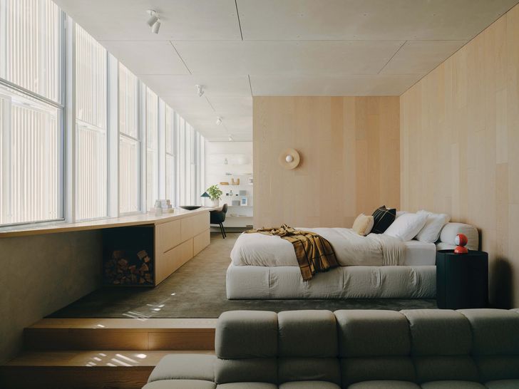 Timber walls wrap the first-floor retreat and main bedroom.