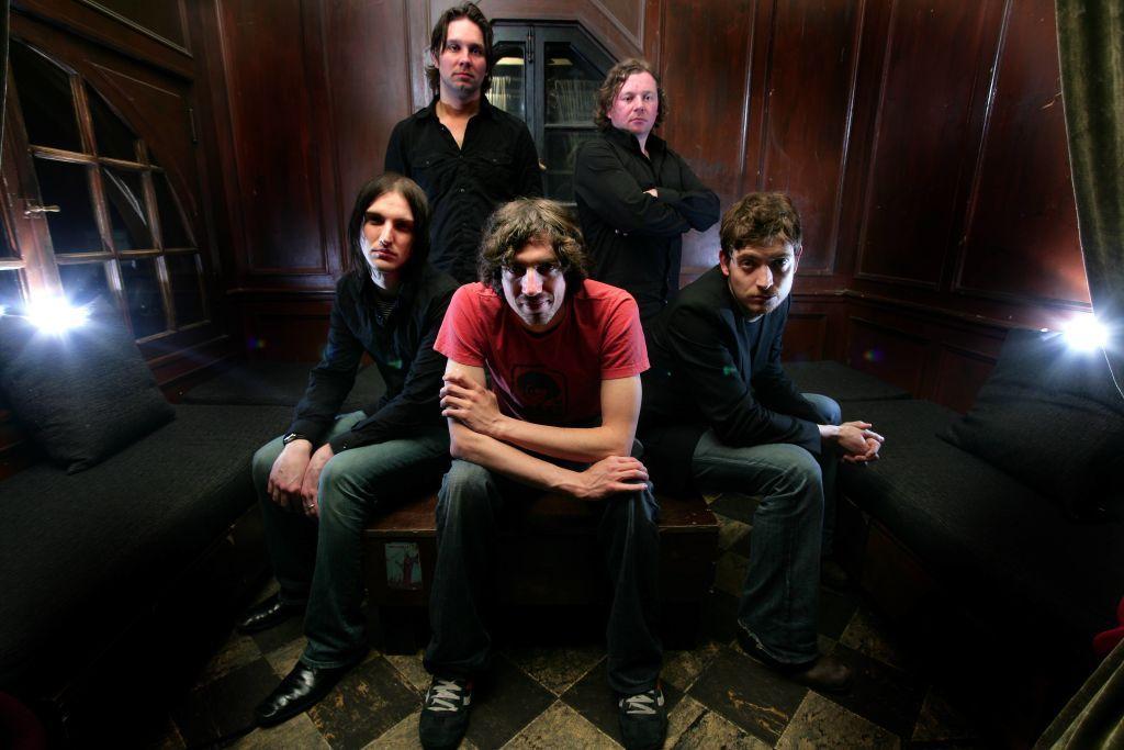 Snow Patrol pictured backstage in a wood-panelled room during their 2006 US tour