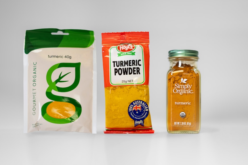 Packets of turmeric from three brands: Gourmet Organic, Hoyt's and Simply Organic.