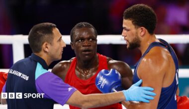 Aziz Abdul reacts after being disqualified for a headbutt during fight against England's Damar Thomas