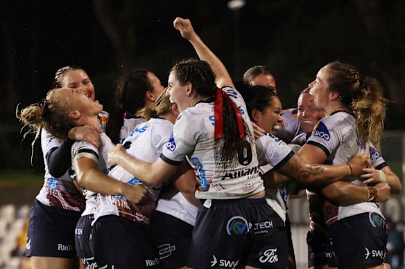 Players celebrate victory during the round five Super Rugby Women’s match between NSW Waratahs and Queensland Reds.