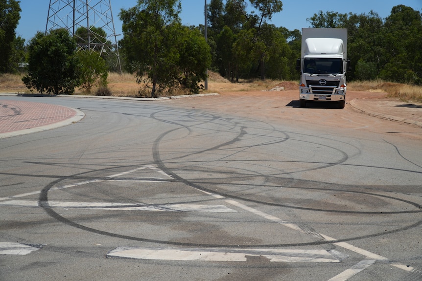 The Lloyd Street roundabout is covered with tyre marks from drivers doing burnouts.